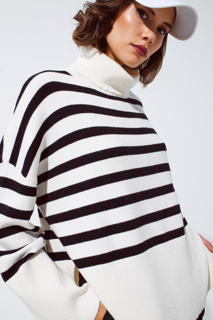 White oversized trutleneck sweater with black stripes and splits on the side