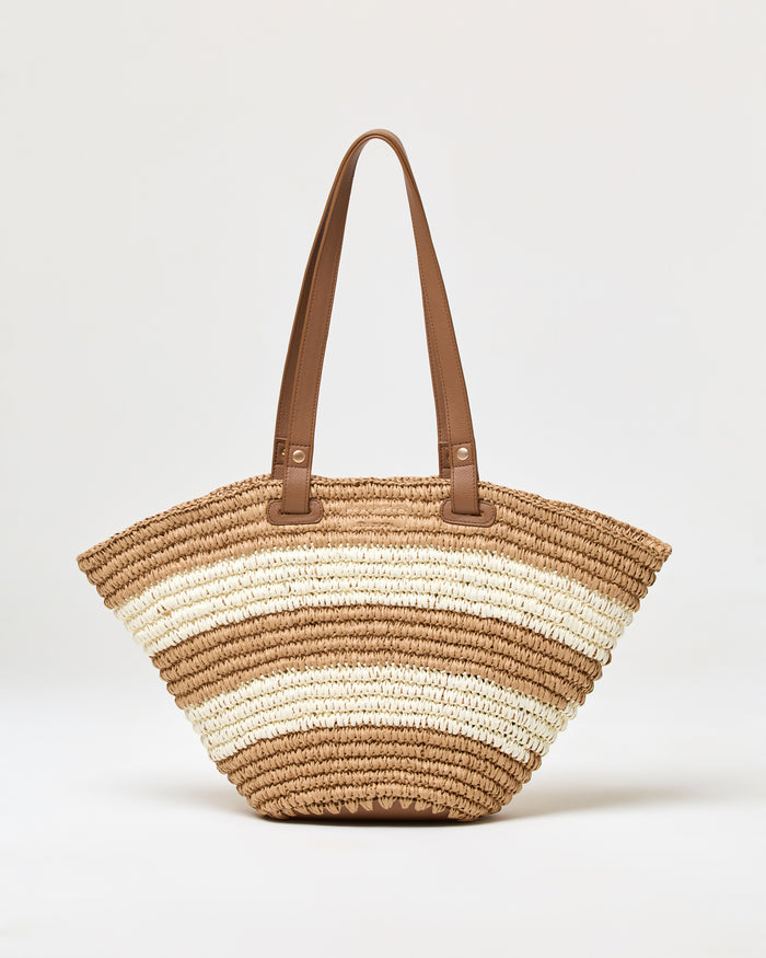Off-model front view of the natural stripe Yuli Tote, featuring tan and cream horizontal stripe woven construction with brown leather shoulder straps.